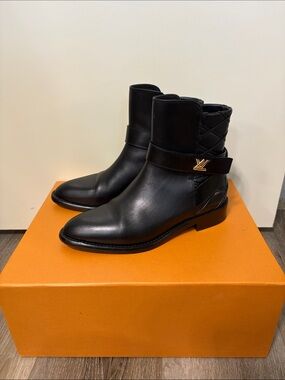Louis Vuitton Black Leather Ankle Boots with Gold LV Accent